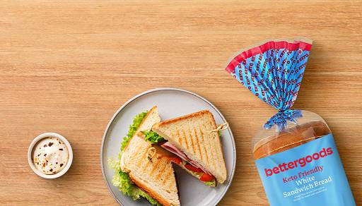 A pack of bettergoods keto-friendly bread is shown next to a toasted sandwhich.