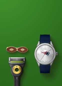 View a razor, a hair clip and a New England Patriots watch.