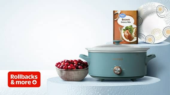 A crockpot, cranberries, gravy mix, and paper plates are visible.