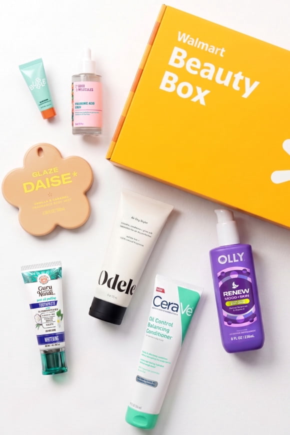 Walmart Beauty Box with assorted skincare and hair products from Odele, CeraVe, Olly, Burt Bees and Blaze Daise on a white surface.