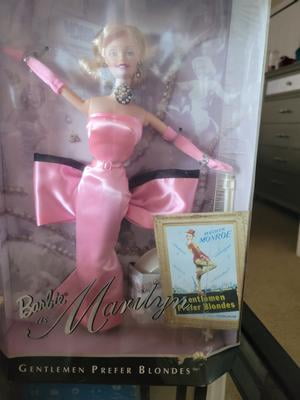 marilyn monroe barbie pink dress Barbie - Classic silver screen look? Yes, please! Give a nod to classic  Hollywood glamour with a magenta, one shoulder dress. Marilyn Monroe  Giftset  (No Longer Available from Mattel)