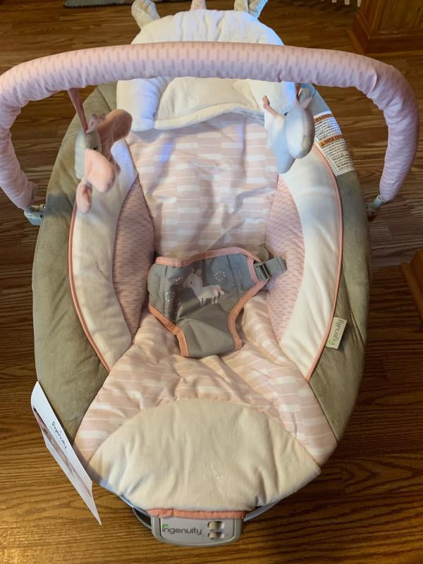 audrey cradling bouncer in pink