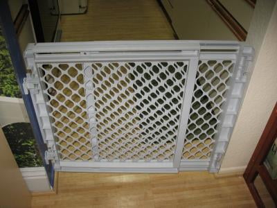 white plastic baby gate