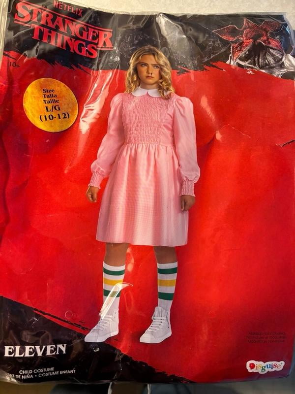 eleven in pink dress and wig An Eleven From 'Stranger Things' Halloween Costume Idea That Will  Delightfully Freak Everyone Out