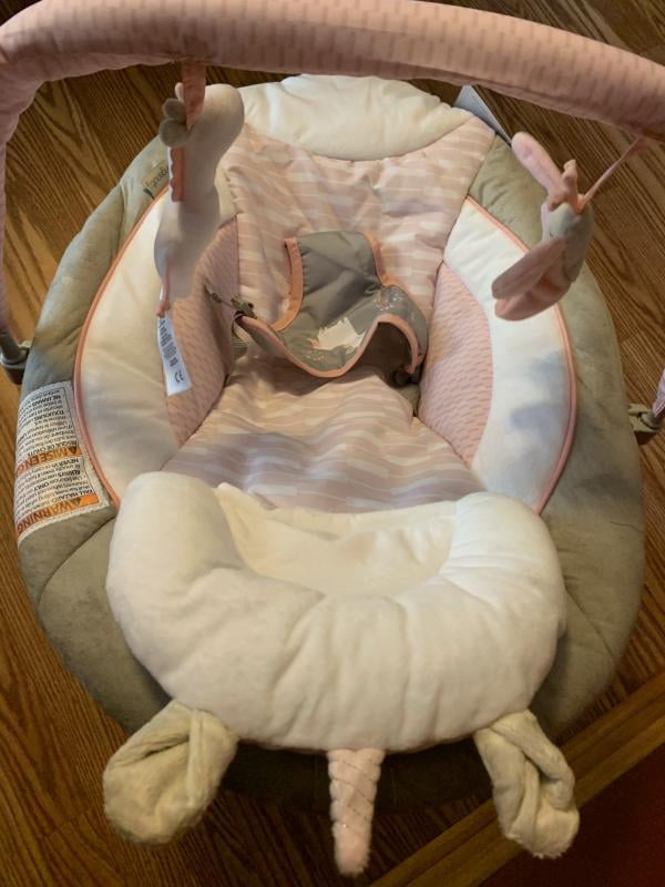 audrey cradling bouncer in pink