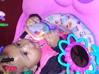 pink and purple exersaucer