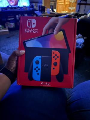 Nintendo Switch (OLED model) w/ Neon Red & Neon Blue Joy-Con
