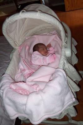 newborn in bassinet