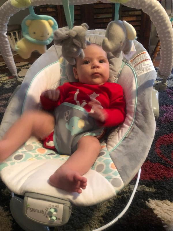 audrey cradling bouncer in pink