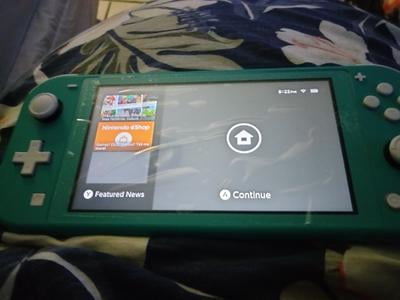 Restored Nintendo Switch Lite Console, Turquoise (Refurbished