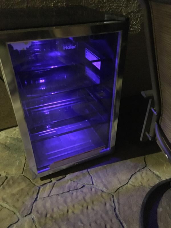 mini fridge with glass door and blue light