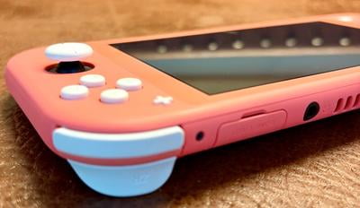 Nintendo Switch Lite, Coral, 5.5-inch Screen, 32GB Storage