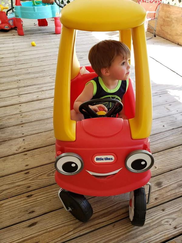 red plastic car with yellow roof
