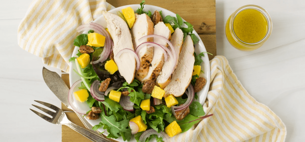 Peach-Mango chicken salad with candied pecans