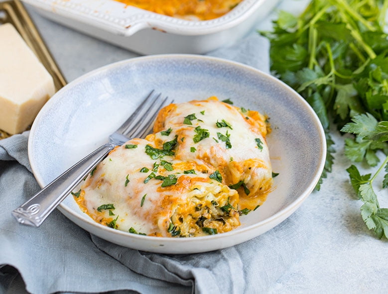 Crab, kale & ricotta lasagna rolls with pumpkin sauce