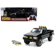 1/24 Diecast Model Car 1985 Toyota SR5 Pickup Truck Black with Martys Skateboard "Back to the Future" 1985 Movie "Hollywood Rides" Series by Jada