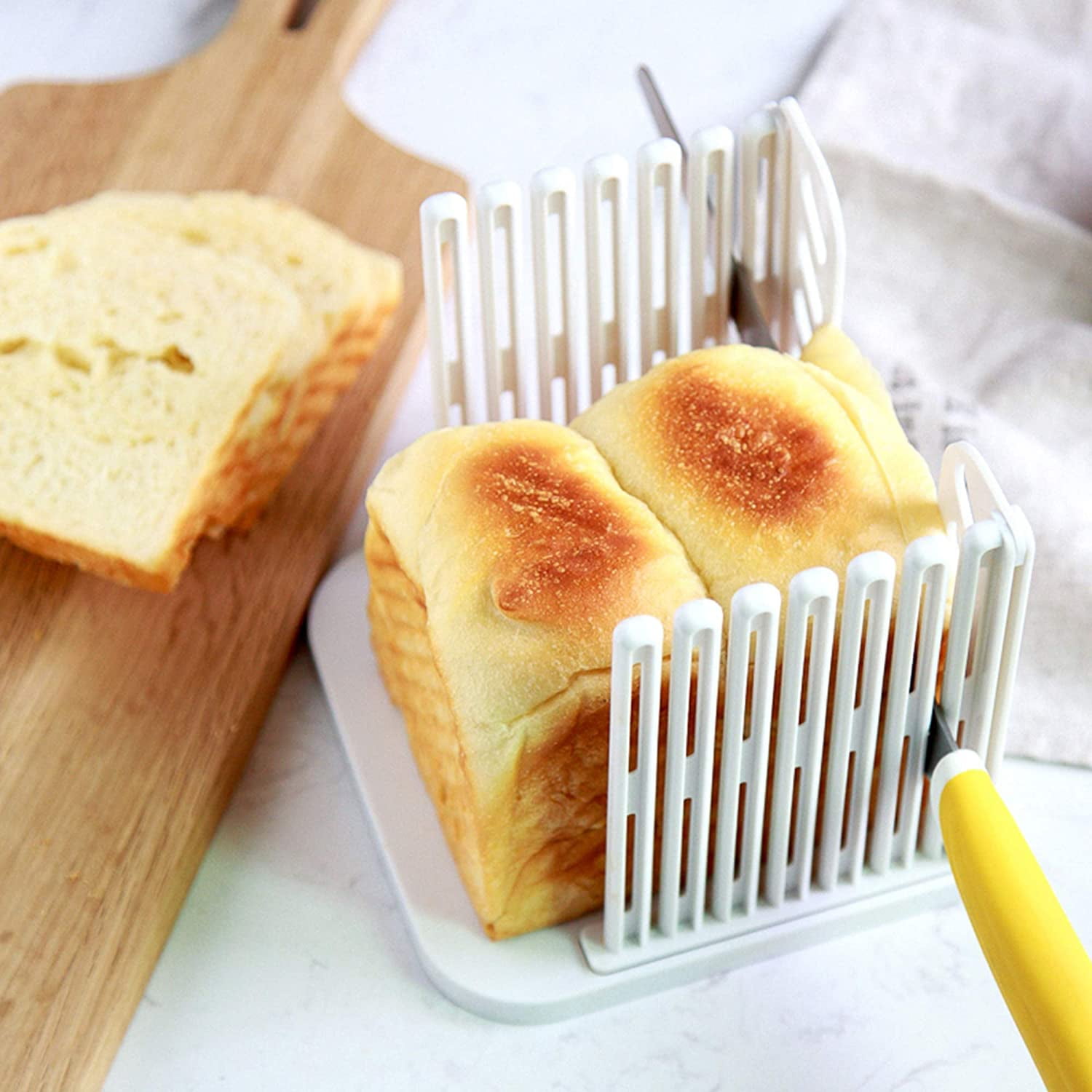 https://i5.walmartimages.com/seo/1-Pack-Bread-Slicer-Resin-Foldable-and-Adjustable-Bread-Toast-Slicer-Bagel-Slicer-Loaf-Sandwich-Bread-Slicer-Toast-Slice-Cutter-Mold_69415dbd-89b2-4ca3-a604-eec3cd584f29.4f97ef9b5a929d7ec048c282b605ad65.jpeg