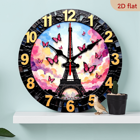A 10-inch wall-mounted clock featuring the butterfly of the Eiffel Tower as the main motif. The surrounding pink butterflies and black and gold numbers exude French romance.
