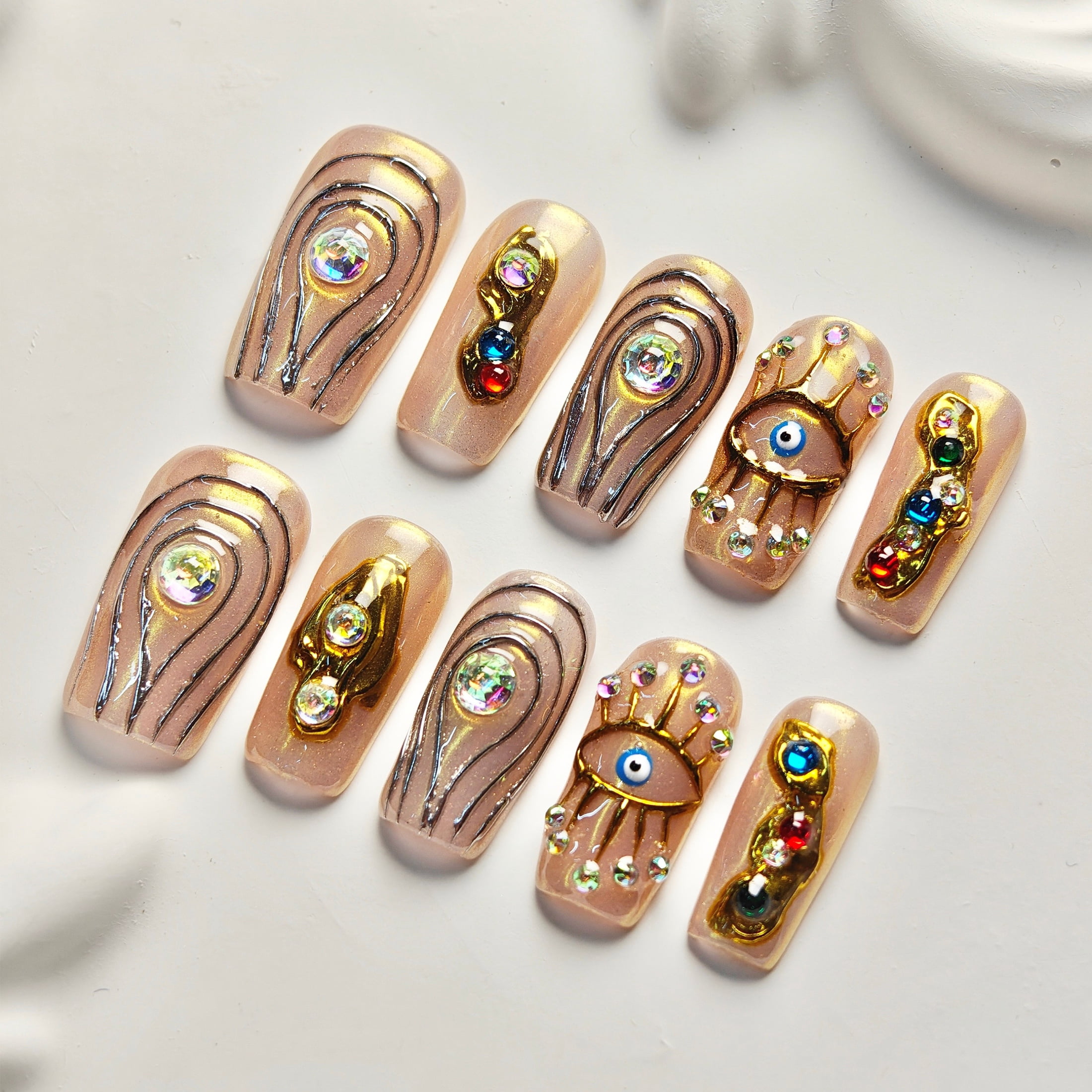 10pcs Stiletto Medium Handmade Y2K Nails - Pink & Nude Base, Hand Drawn Gold Eye & Line Patterns, 3D Rhinestone & Colorful Gems, Summer & Party Nails for Women