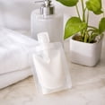thumbnail image 1 of 12Pcs Transparent Portable Fluid Packing Bags,New Travel Size Refillable Empty Squeeze Pouch, Premium Clear Travel Pouches for Toiletry, Lotion Shampoo Shower Gel Squeezable Bags (30ml), 1 of 5