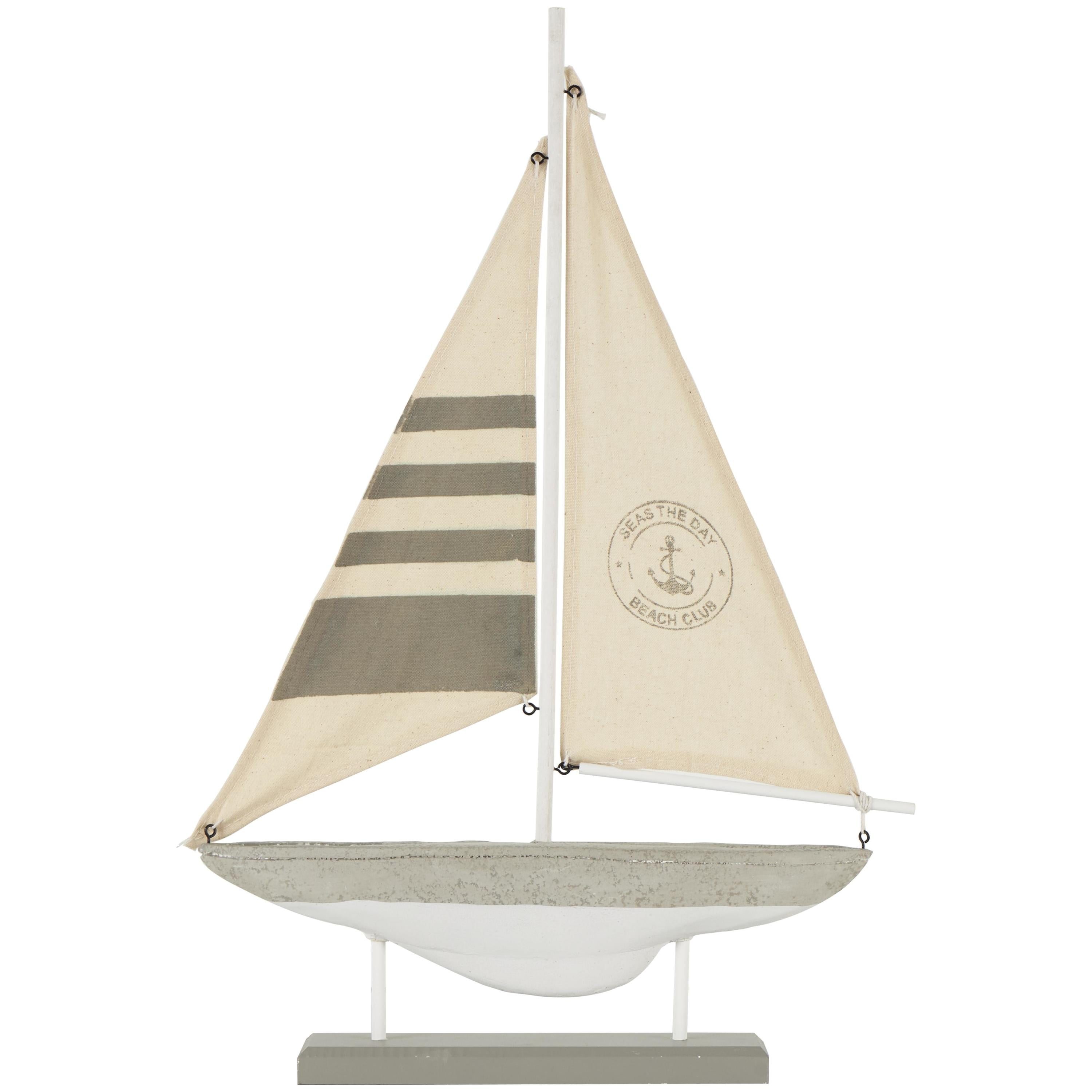 Gray and White Cement and Cotton Sail Boat Statue