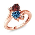 thumbnail image 1 of Gem Stone King 18K Rose Gold Plated Silver Red Garnet Persian Blue Moissanite and White Diamond Ring for Women (1.83 Cttw, Heart Shape 6MM, Gemstone January Birthstone, Size 8), 1 of 6