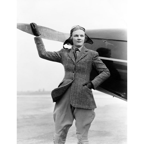 1930s Woman Aviator Pilot Standing Next To Airplane One Hand On Propeller Flight Goggles Cap Tweed Suit Fashion Print By