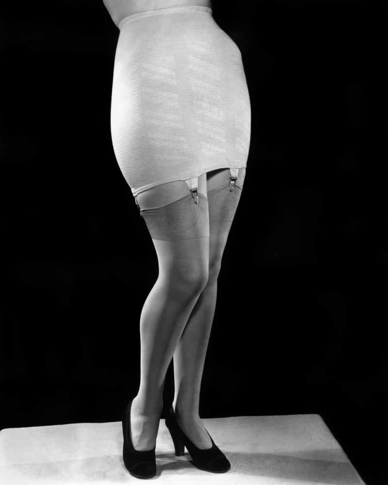 1940s Fashion Woman From Waist Down Wearing Girdle With Garters Clips  Holding Silk Nylon Hose Stockings Print By Vintage