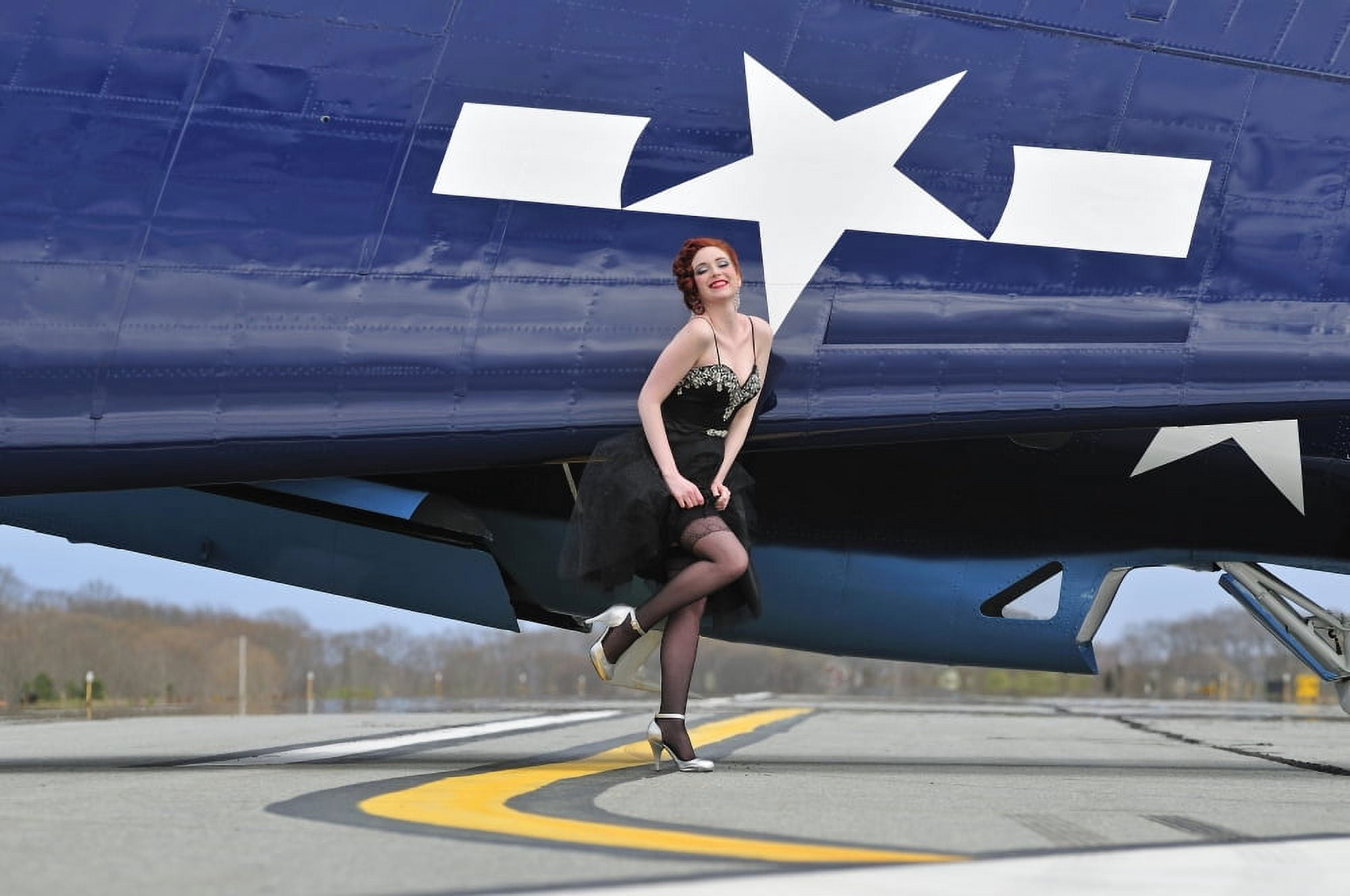 1940s style pin-up girl in cocktail dress posing in front of a TBM Avenger Canvas Art - Christian KiefferStocktrek Images (35 x 23)