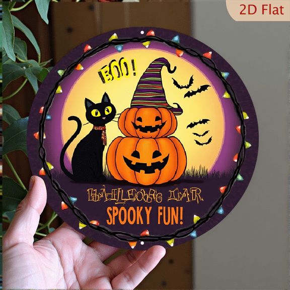 1pc Halloween Round Metal Wall Decor - Black Cat with Stacked Jack-o'-lanterns wearing a striped witch hat, surrounded by festive string lights and bats, with "BOO!" and "SPOOKY FUN!" text
