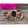 thumbnail image 1 of 2.50 Carat Oval Cut Black Diamond Moissanite Engagement Ring Set Floral leaf diamond wedding band Bridal Ring Set 10k Rose Gold Halo Design, 1 of 5