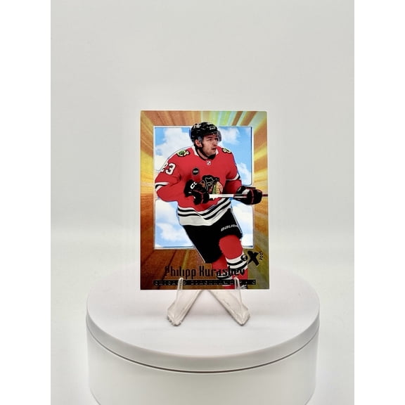 2023-24 NHL E-X 2000 Orange Parallel #66 Philipp Kurashev Base Set Leaf Chicago Blackhawks