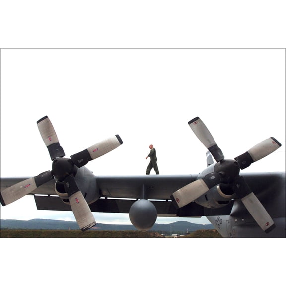 24"x36" Gallery Poster, Technician walks wing of C-130 Hercules Ramstein 37th Airlift Sqd