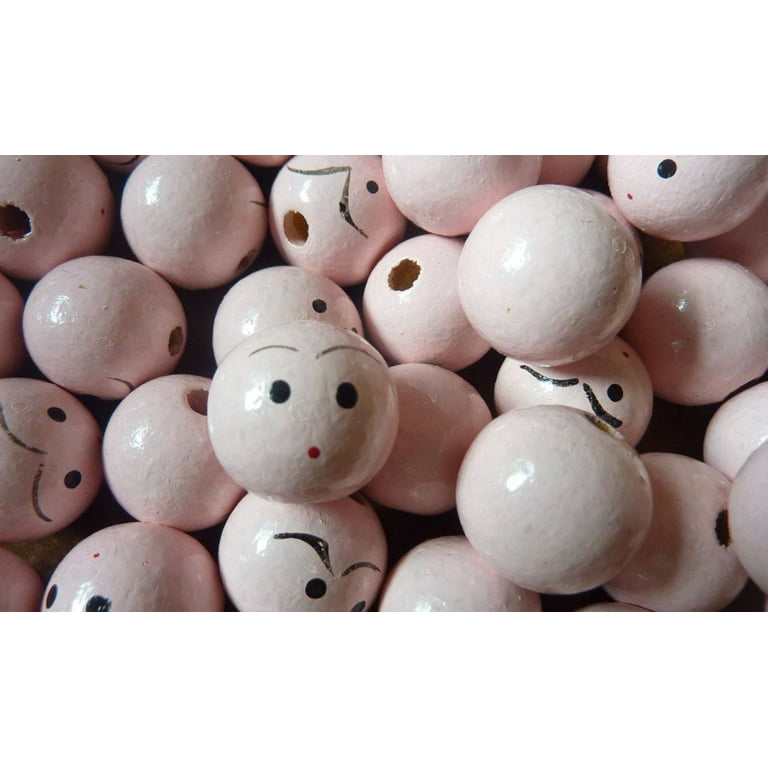 Wooden doll heads with cheap faces