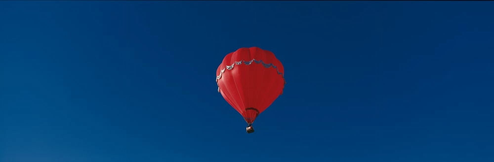 This is the 25th Annual Albuquerque International Balloon Fiesta It shows a red balloon that is part of the mass ascension of colorful balloons Canvas Art - Panoramic Images (36 x 12)