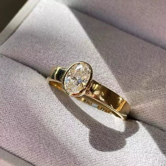 2Ct Lab Created Diamond Oval Cut Bezel Set Women's Engagement Ring In 14K Yellow Gold Plated