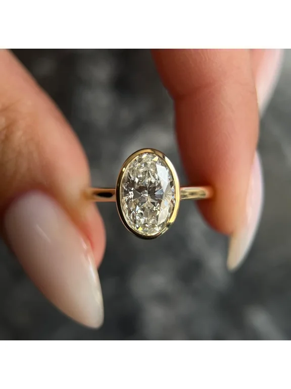 2Ct Oval Cut Lab Created Diamond Bezel Set Solitaire Engagement Ring in 14K Yellow Gold Plated