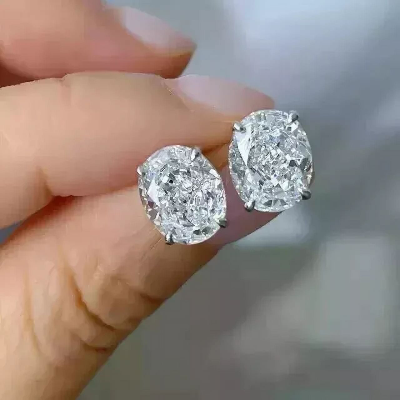 2Ct Oval Cut Lab Created White Diamond Women's Push Back Stud Earrings in 14K White Gold Plated