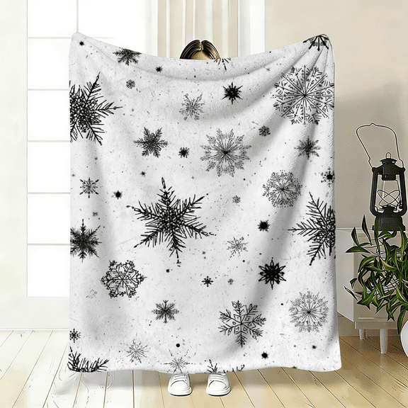 2D plane, "black and white snowflake" flannel blanket. Soft and skin-friendly, suitable for scenarios such as sofas and beds. Specification dimensions: 30×40 inches, 40×50 inches, 50×60 inches.
