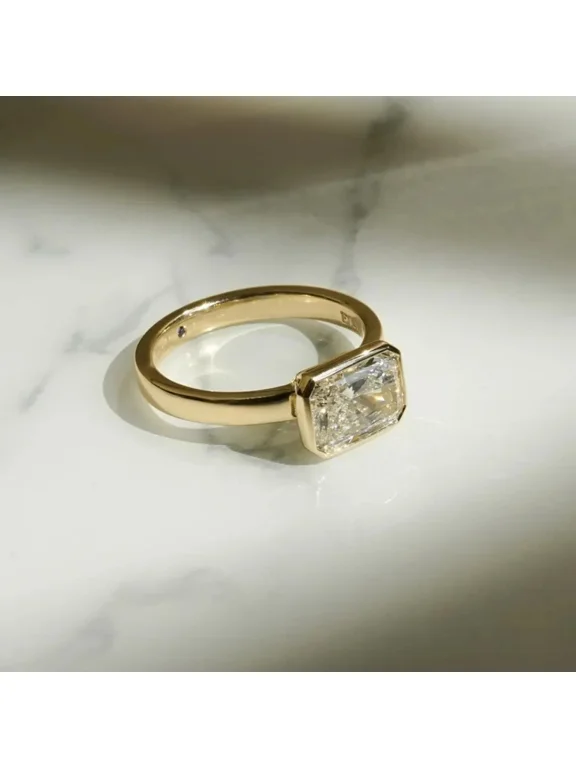 3 Ct Radiant Cut Simulated Diamond East-West Bezel Solitaire Engagement Ring in 14K Yellow Gold Plated