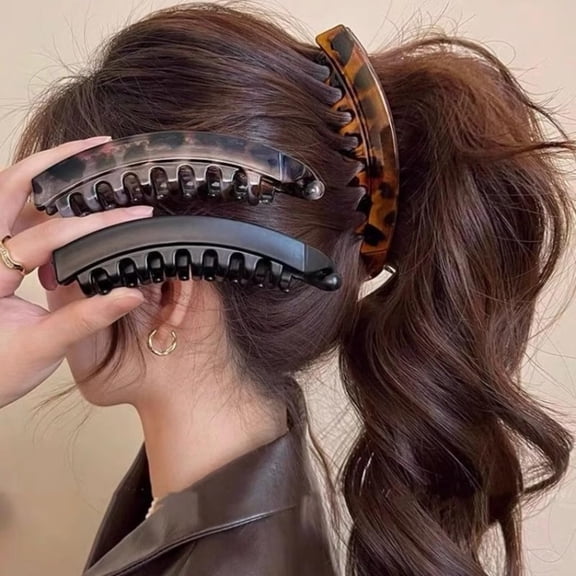 3-Piece Set of Large High Ponytail Banana Clips Volumizing Effect for Thicker Hair. Vertical Clip Design with Teeth at the Back for Slip Resistance. Available in Black, Gray, and Brown.