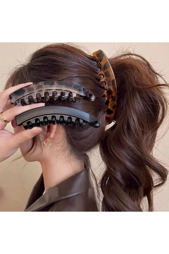 3-Piece Set of Large High Ponytail Banana Clips Volumizing effect for thicker hair. Vertical clip design with teeth at the back for slip resistance. Available in black, gray, and brown.