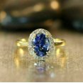 thumbnail image 1 of 3Ct Oval Cut Simulated Tanzanite Halo Engagement Women's Ring 14K Yellow Gold Plated, 1 of 2