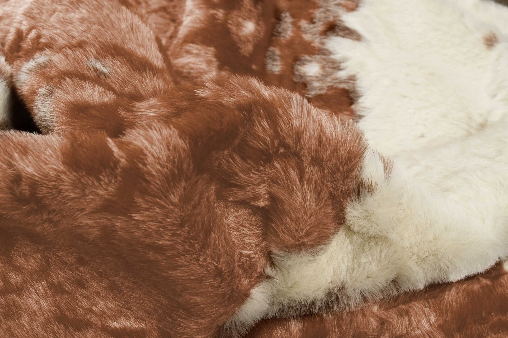 51" x 60" Brown and Ivory Faux Cowhide Area Rug