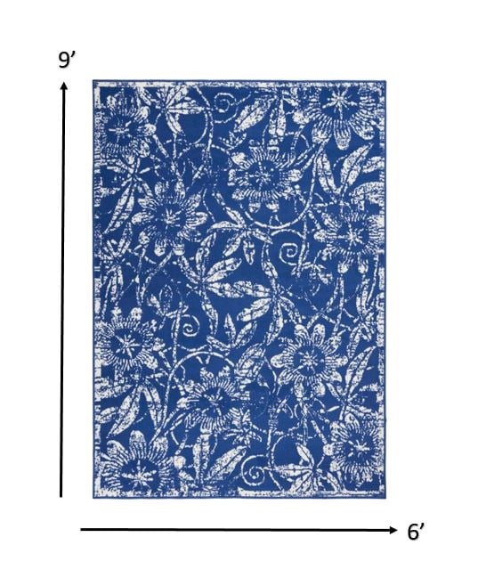 6' x 9' Navy and Ivory Floral Synthetic Area Rug