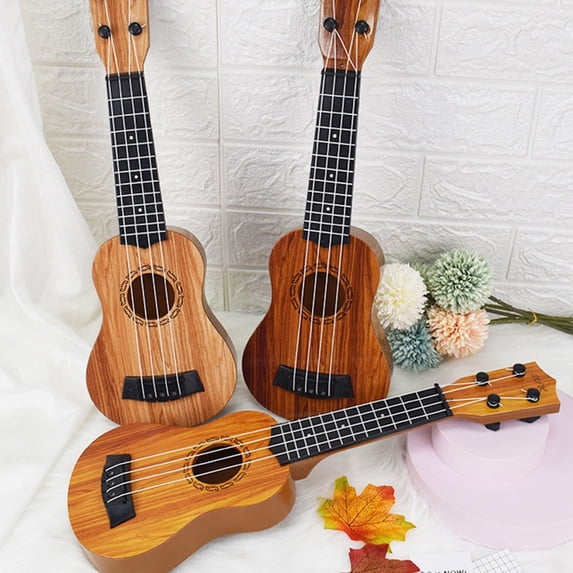 up to 70% off karymi Kids Guitar Ukulele Beginner Musical Instrument 14 Inches with 4 Strings Mini Guitar for Skill Improving Kids Play Early Educational Pre School Kids Toys for Ages 5-7