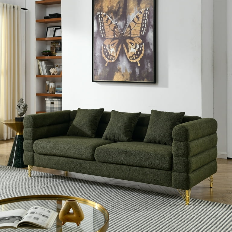 Green couch with outlet pillows