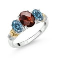 thumbnail image 1 of Gem Stone King 925 Sterling Silver and 10K Yellow Gold Oval Red Garnet Persian Blue Moissanite and White Diamond 3 Stone Ring for Women (2.46 Cttw, Gemstone January Birthstone, Size 6), 1 of 3
