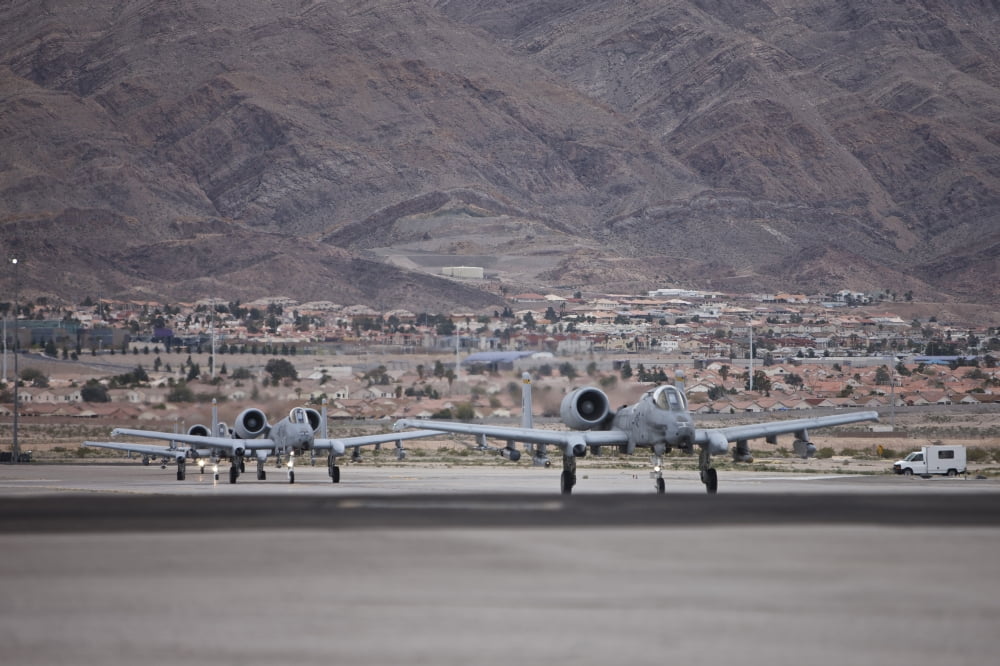 A-10 Thunderbolts taxi to the runway at Nellis Air Force Base Nevada Canvas Art - Terry MooreStocktrek Images (35 x 23)