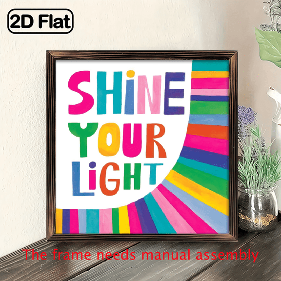A 2D flat "SHINE YOUR LIGHT" wooden frame painting is a home wall decoration.